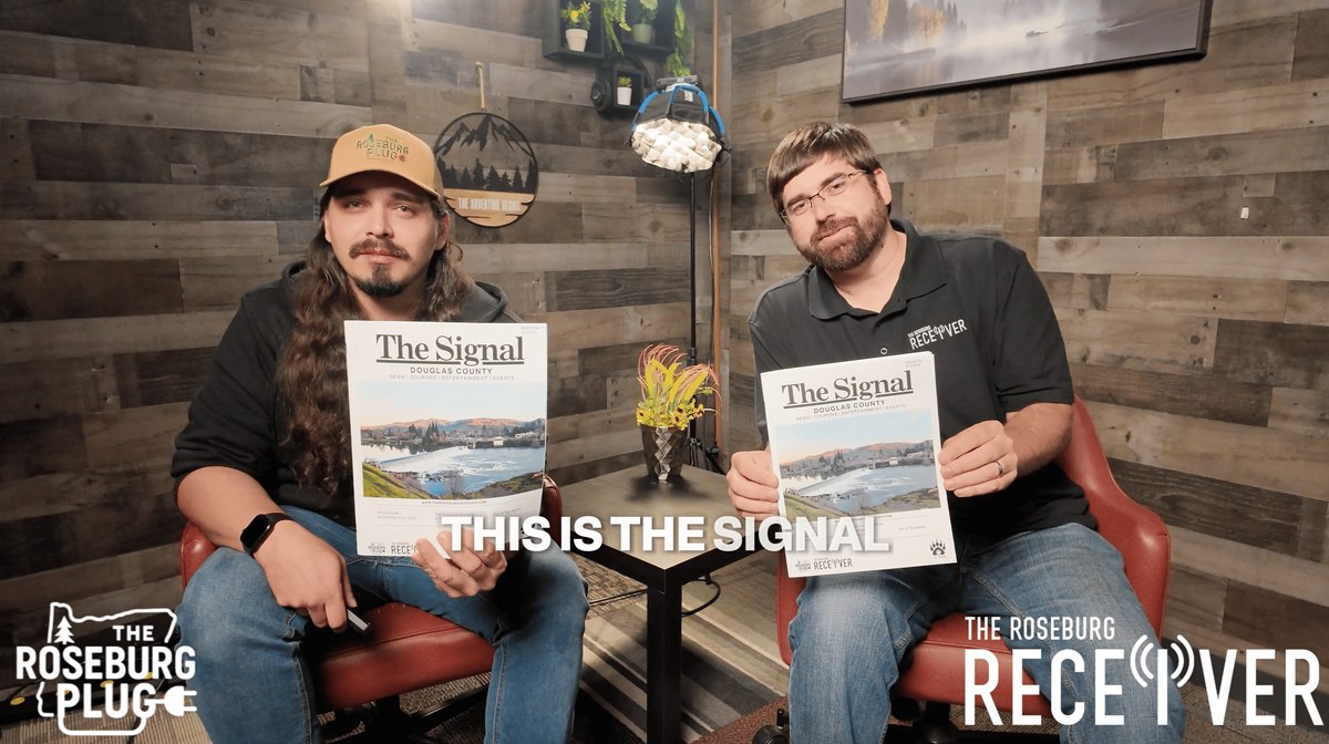 Shane Hayes of The Roseburg Plug and Joseph Ziegler of The Roseburg Receiver holding the first printed copies of The Signal